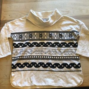 Embroidered 100% cotton cowl neck sweater.